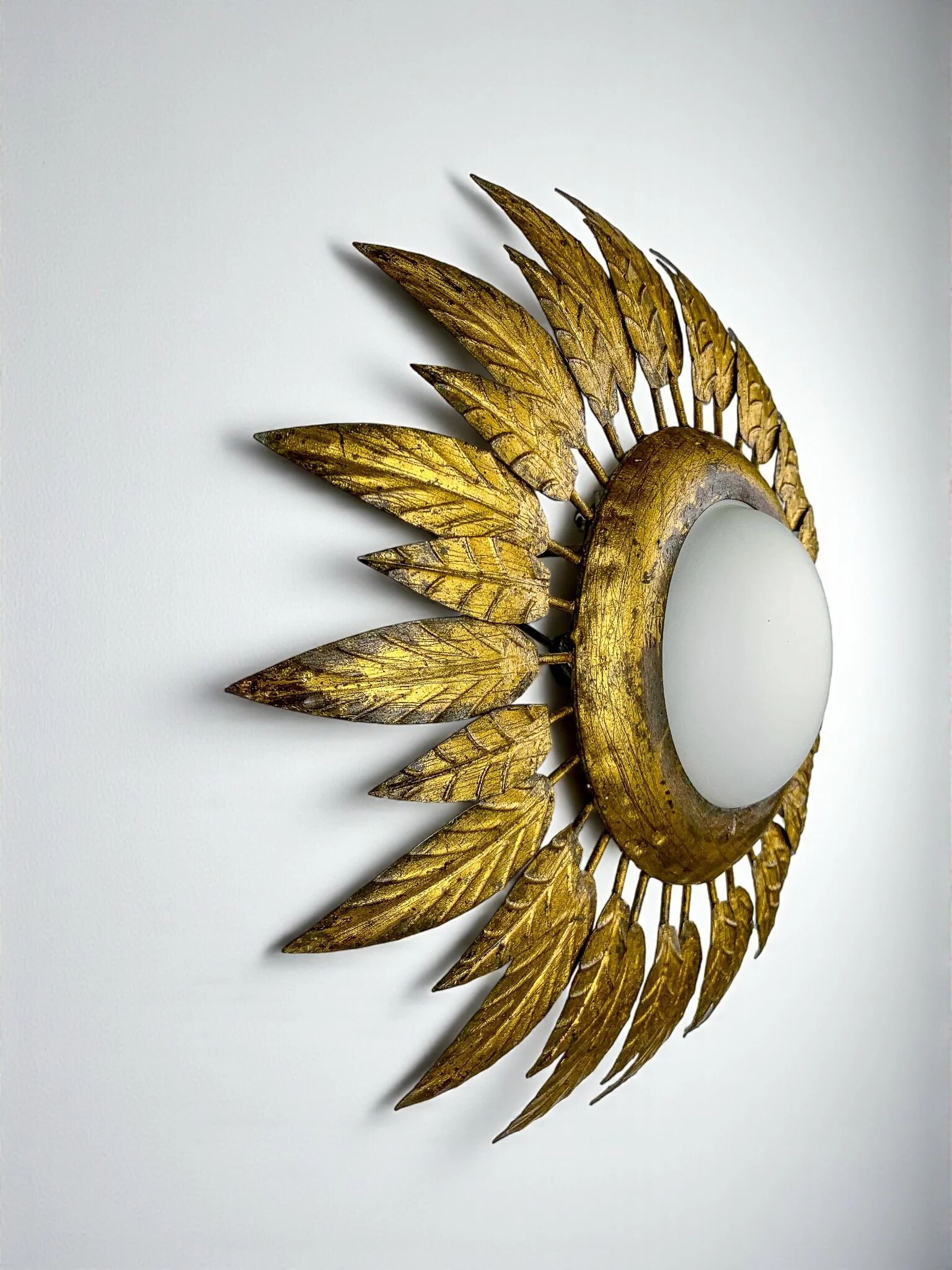 Spanish sunburst ceiling light – opaline glass & gilt iron foliage, 1960s