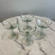 Set of four blown glass stemmed glasses.