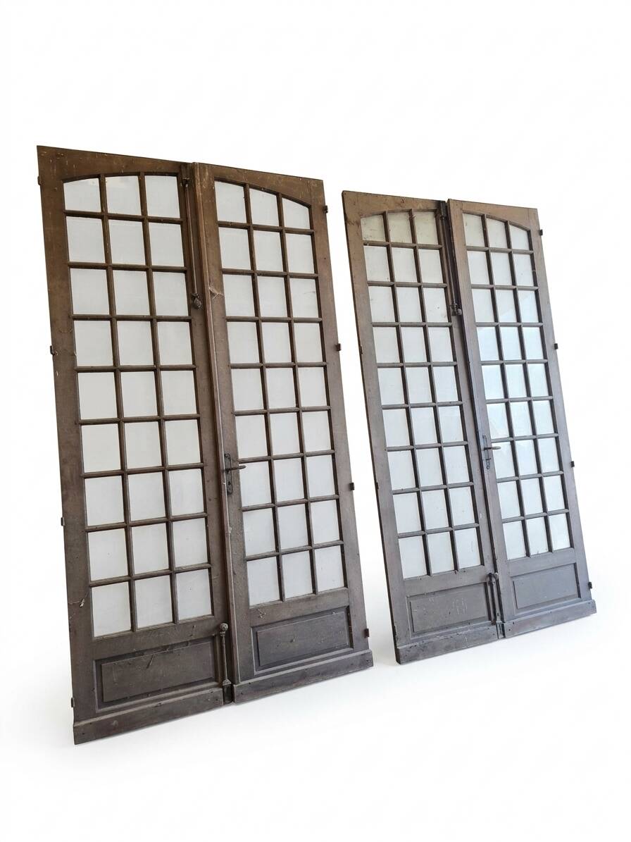 Two pairs of solid oak doors with small panes.