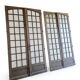 Two pairs of solid oak doors with small panes.