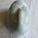 Porcelain duck dish with lid on fire