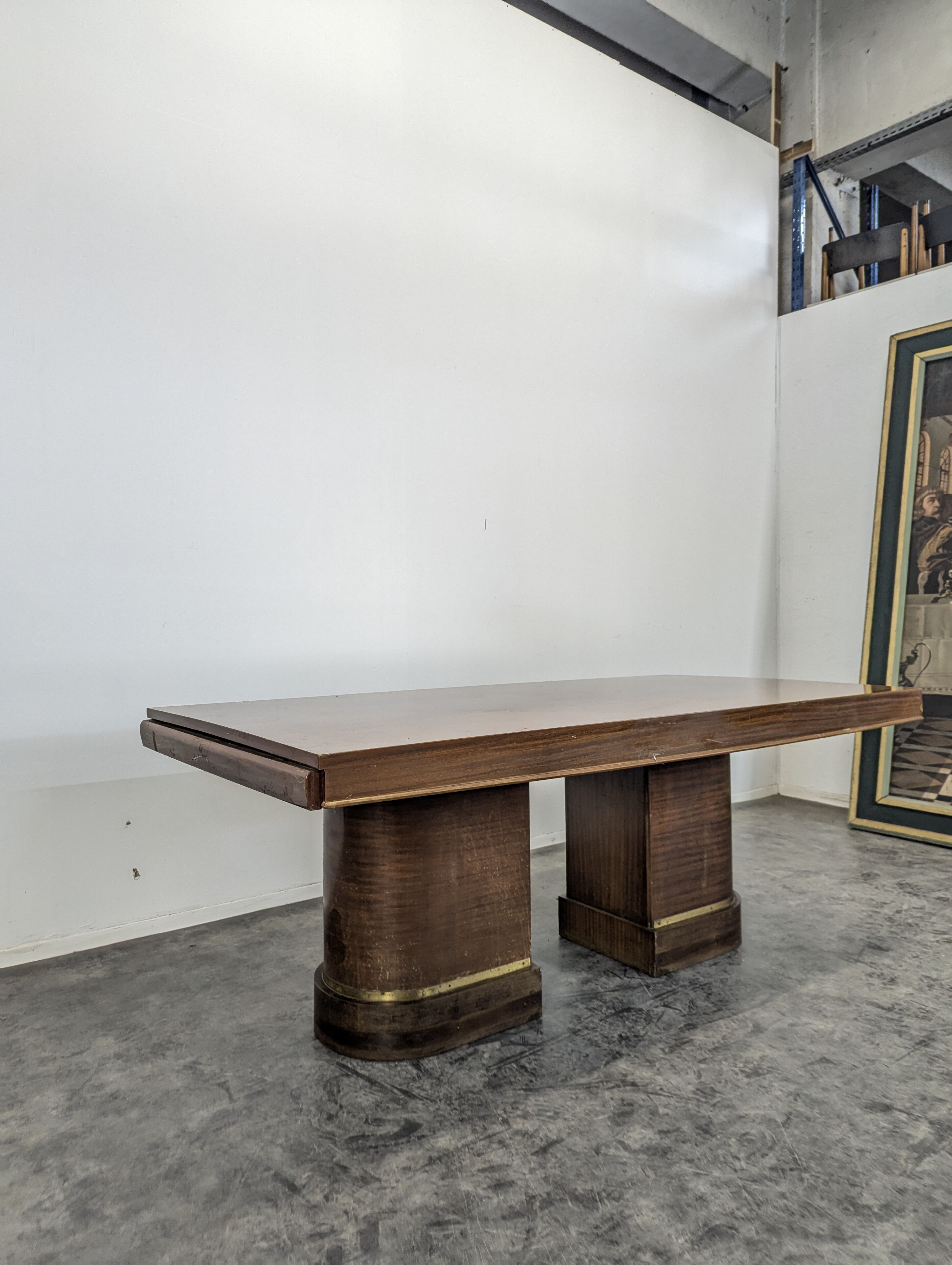 Modernist table in rosewood and brass