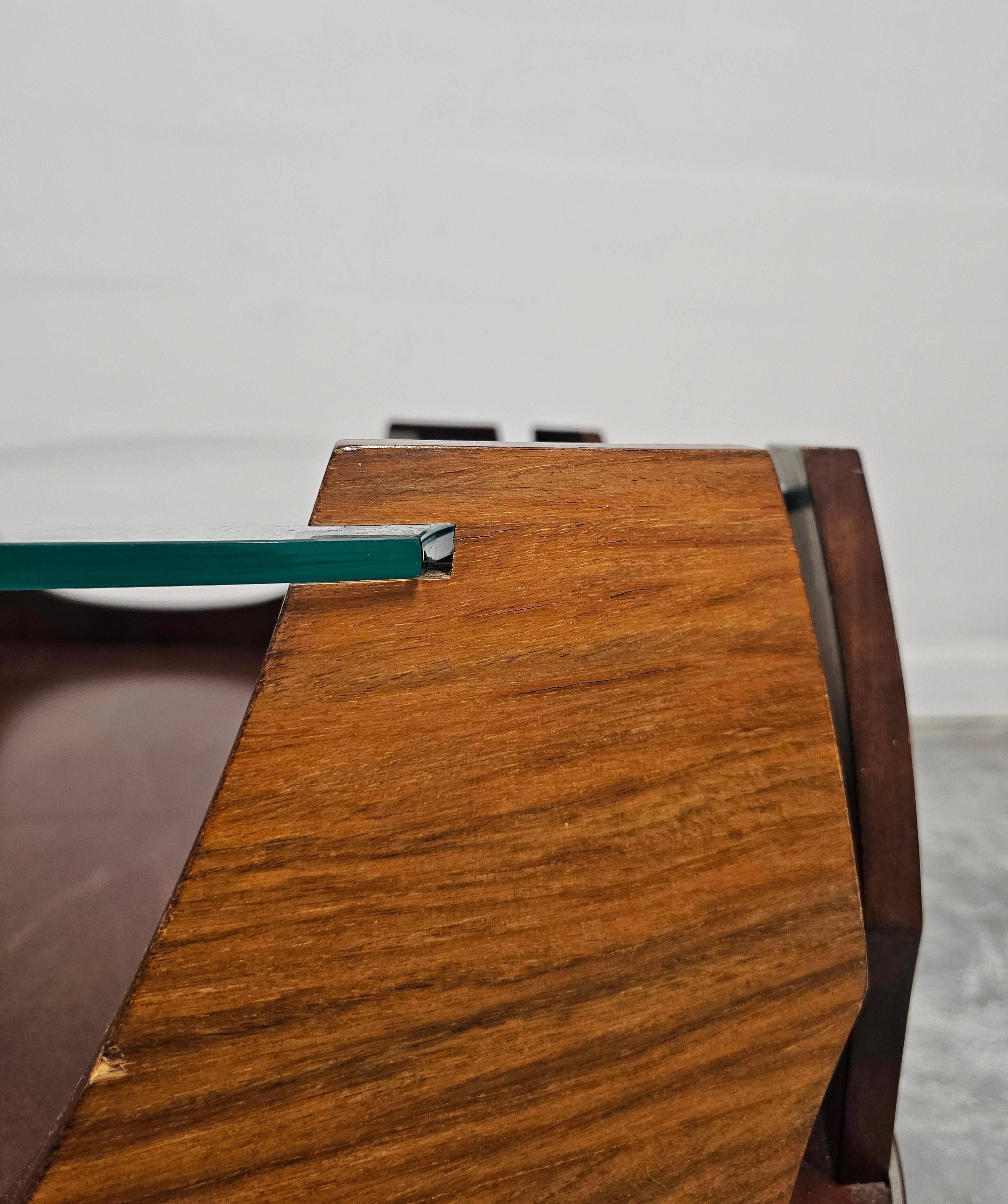 Mid-century coffee table in curved plywood with a glass top, 1940s.