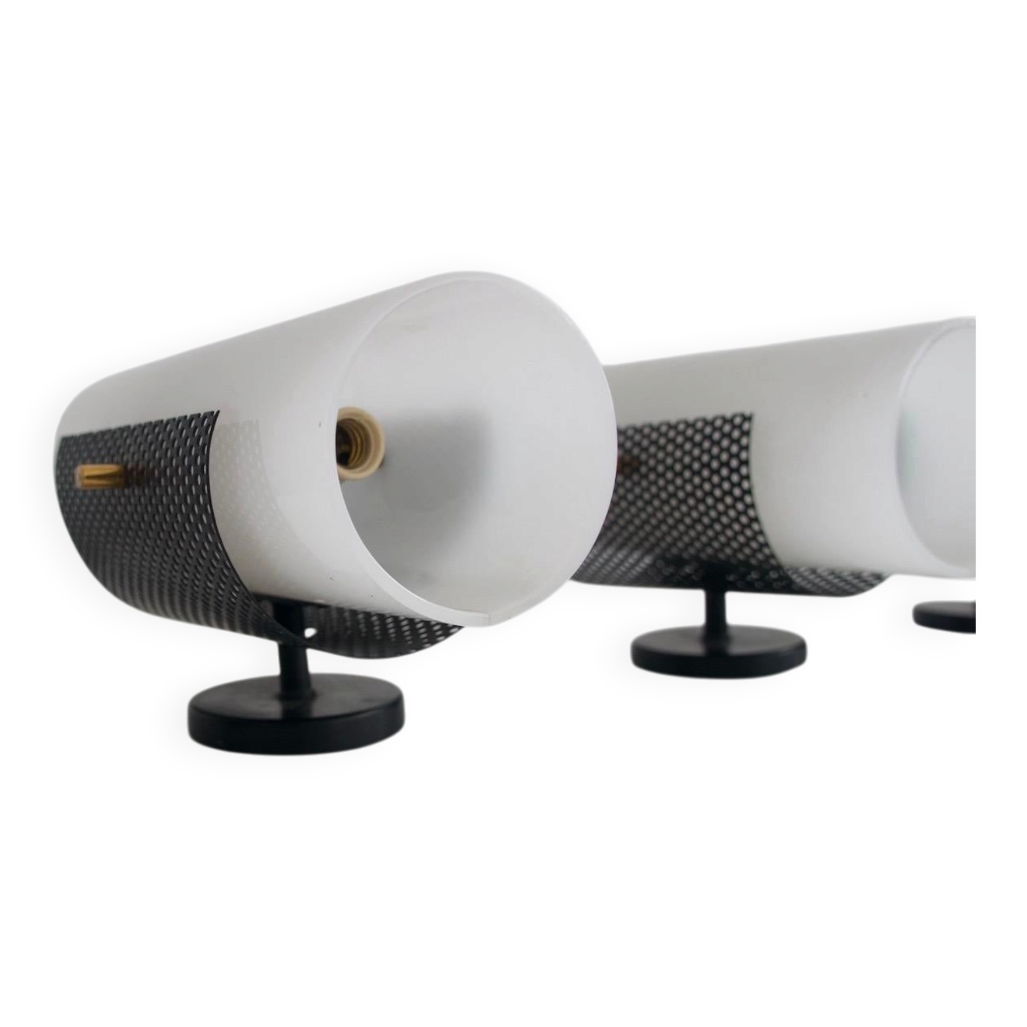 Set of four wall lights in white plexiglass and perforated black metal.