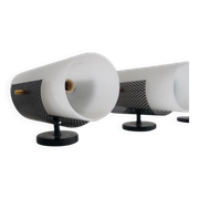 Set of four wall lights in white plexiglass and perforated black metal.