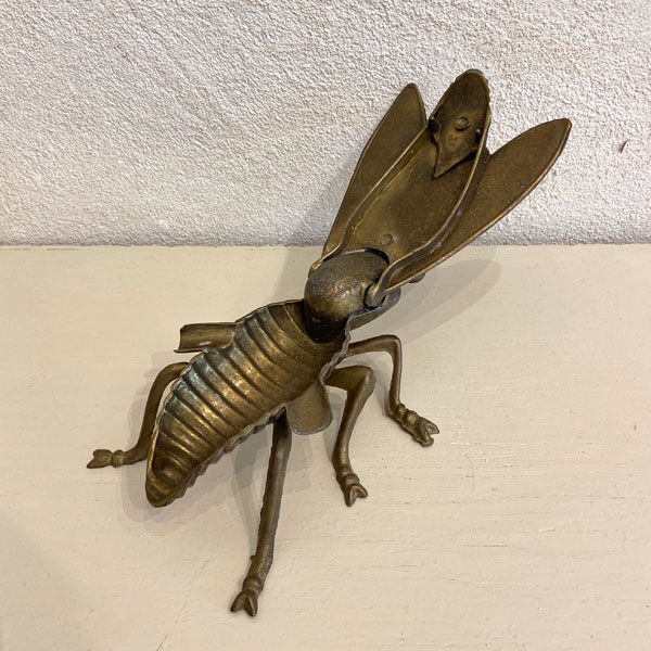 Gold metal ashtray fly
