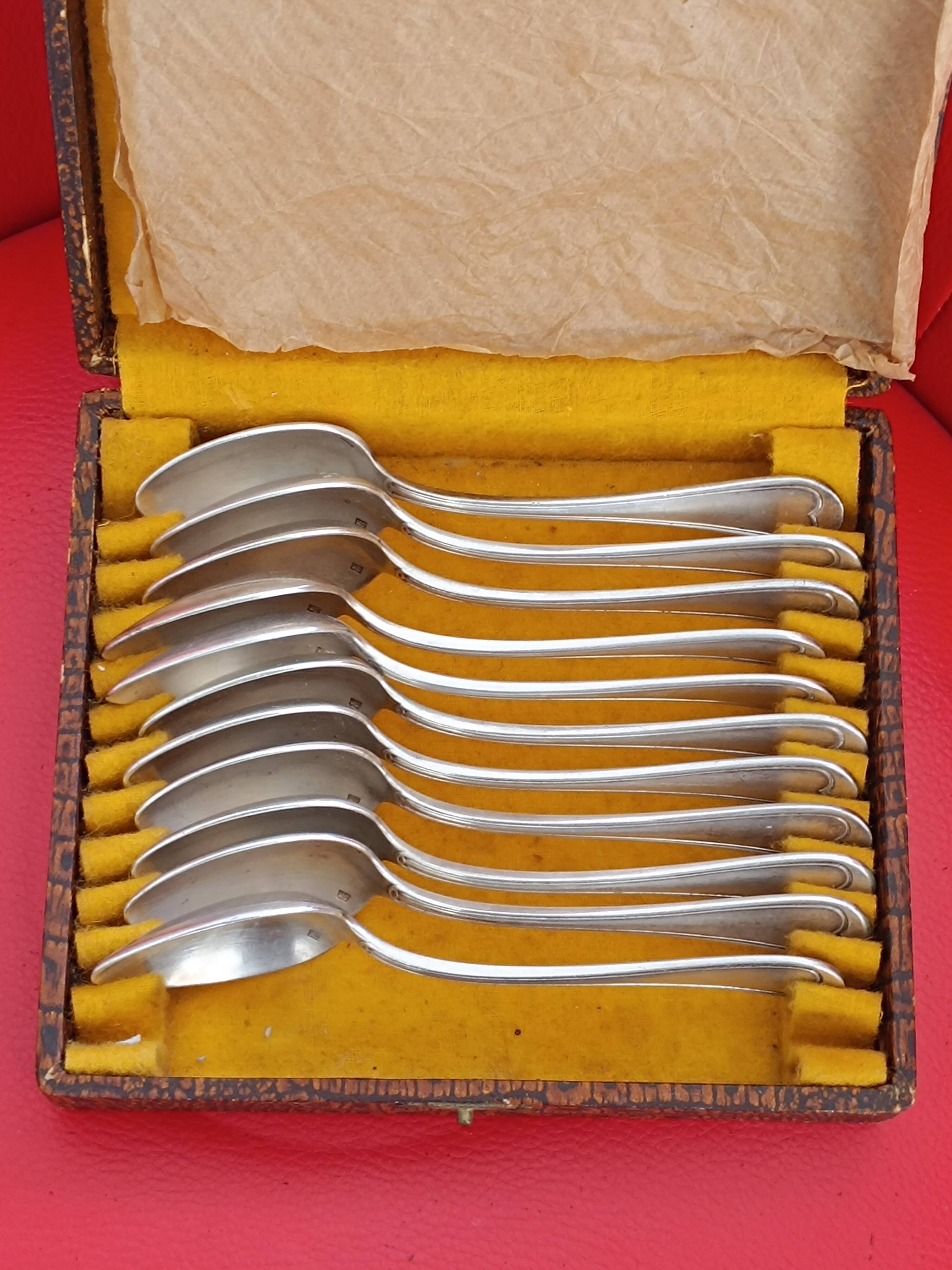 11 Small silver-plated spoons.