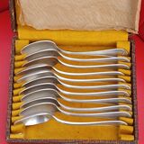 11 Small silver-plated spoons.