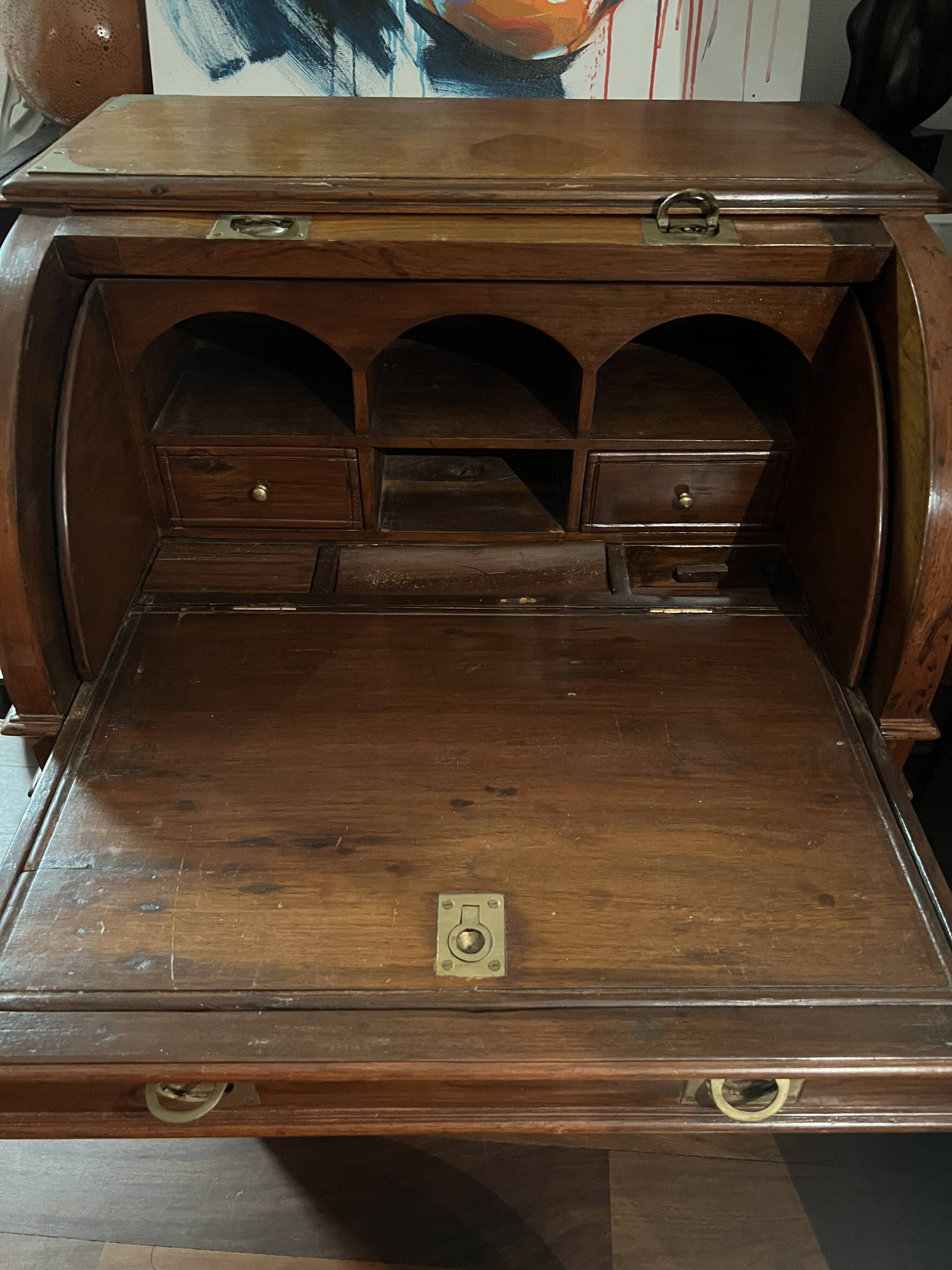 Antique solid wood secretary with a drop-down cylinder compartment.