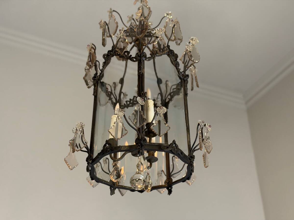 Louis XV style lantern in blackened brass adorned with cut crystal pendants, circa 1900.