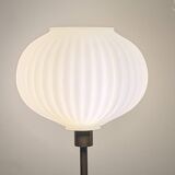 Table lamp with a white striped globe, origami style and a golden foot