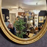 Golden oval mirror