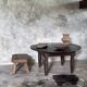 Antique round coffee table in Indonesian teak with turned legs.
