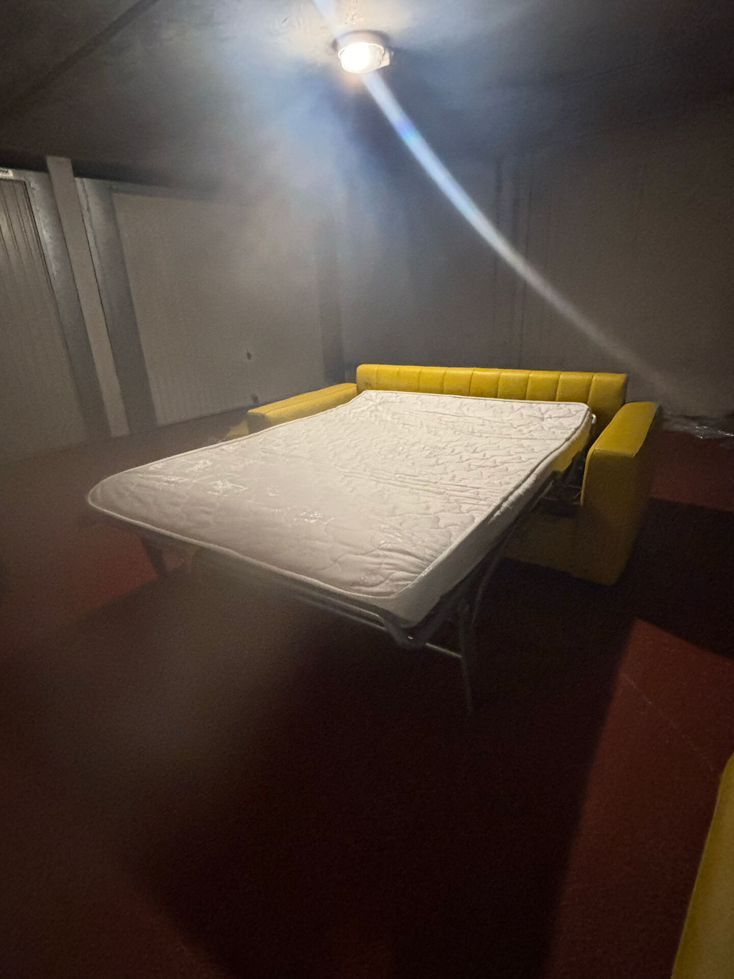 Yellow leather convertible sofa made in Italy.