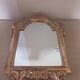Antique mirror in gilded wood.
