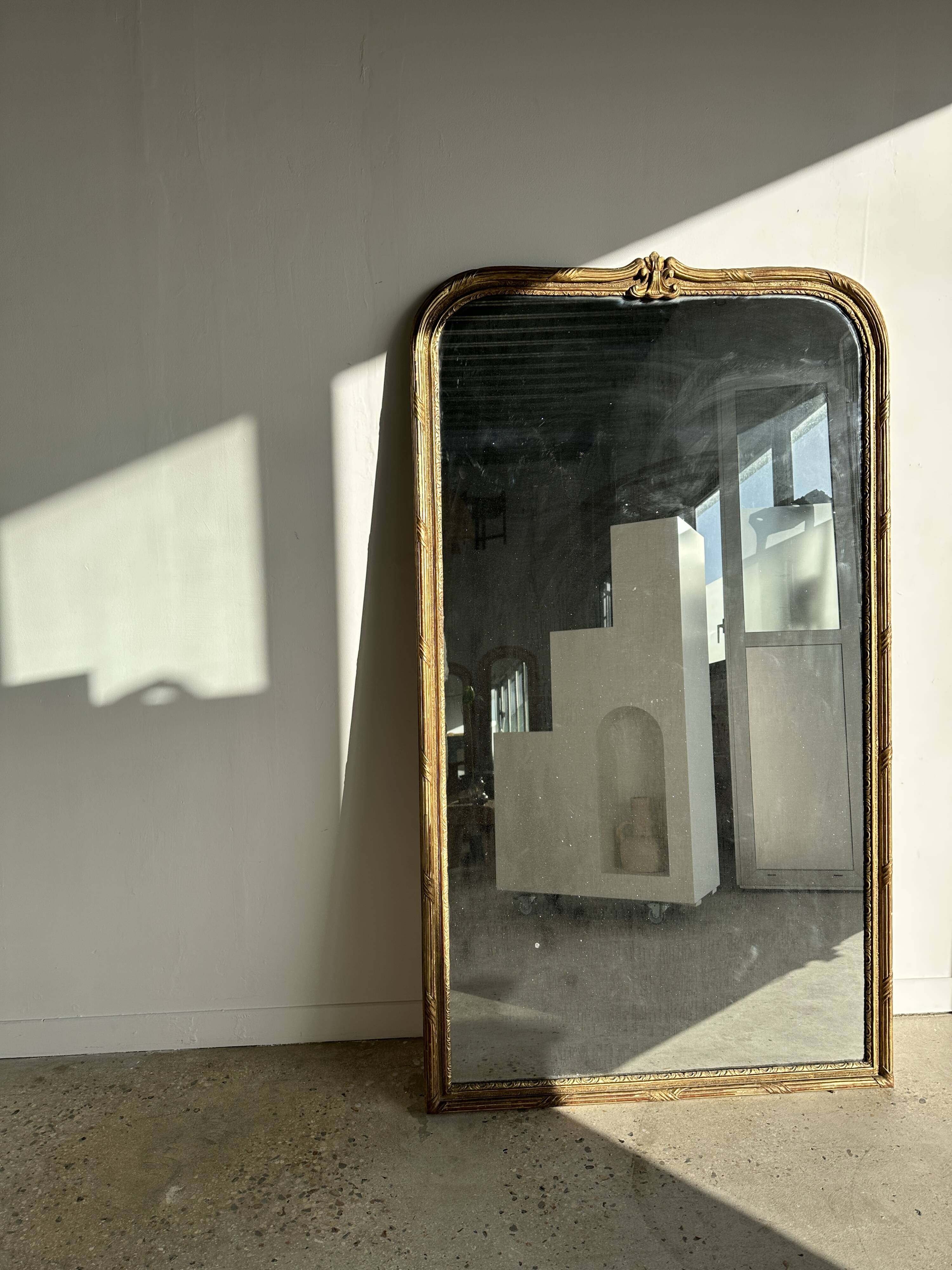 Large gilded mirror 19th century rounded corners mercury glass Louis XVI style
