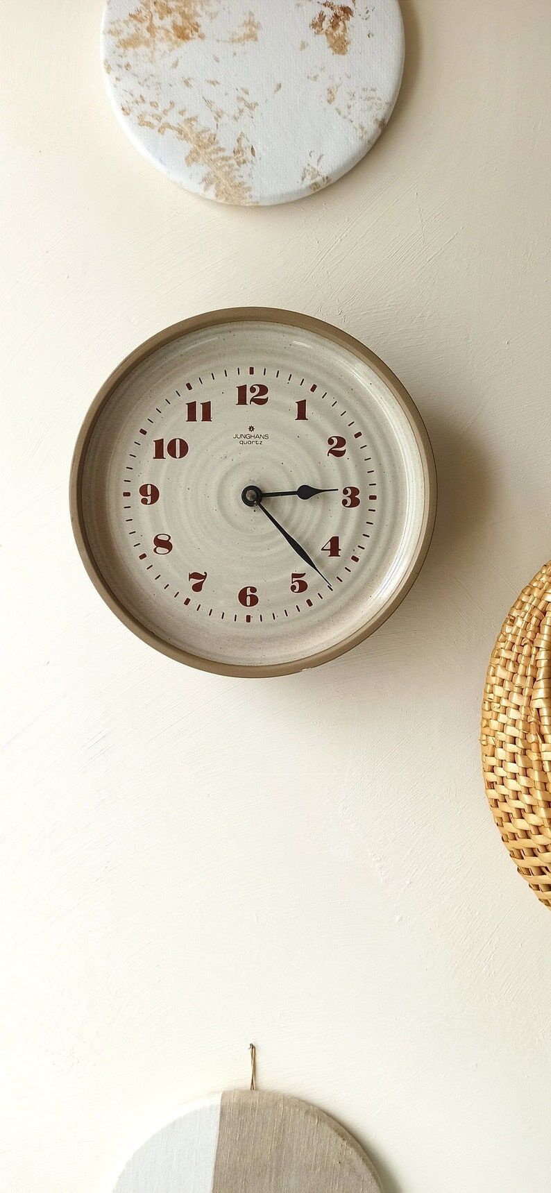 Clock in the shape of a round plate Junghans