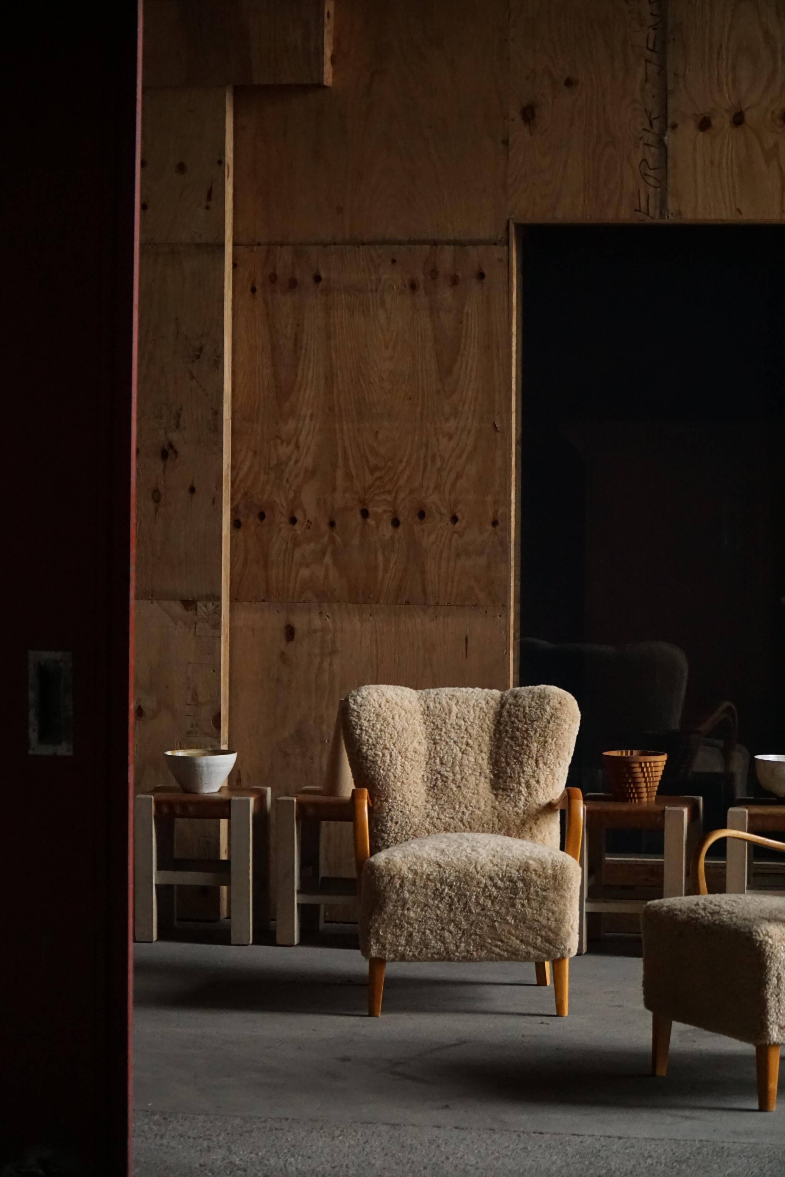 Pair of Mid Century Modern Swedish lounge chairs in birch and lamb's wool, 1960s.