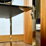 Gold metal side table, in the style of Maison Jansen, 1970s.
