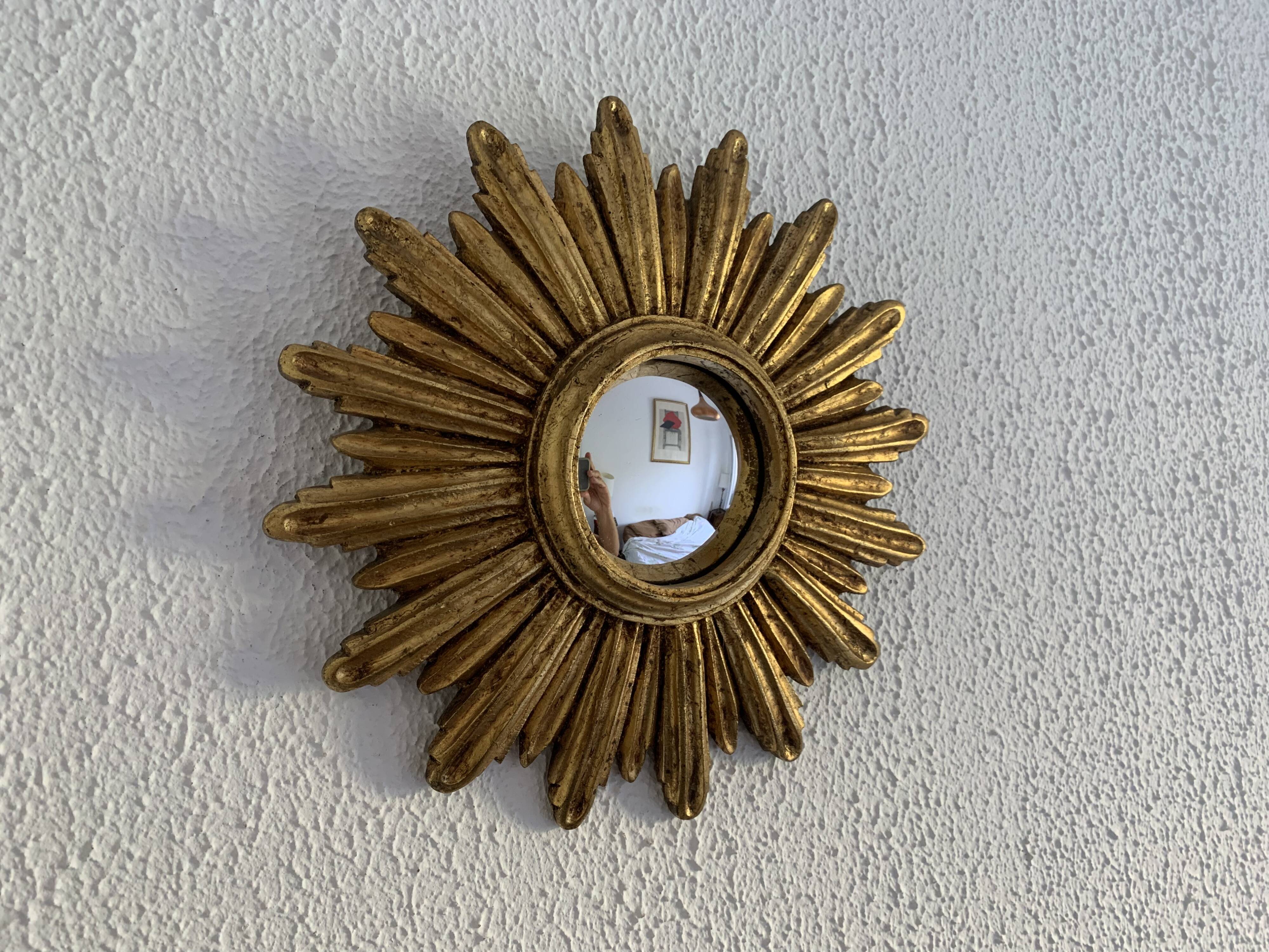 Vintage 1960s sunburst witch's eye mirror in gold - 27 cm