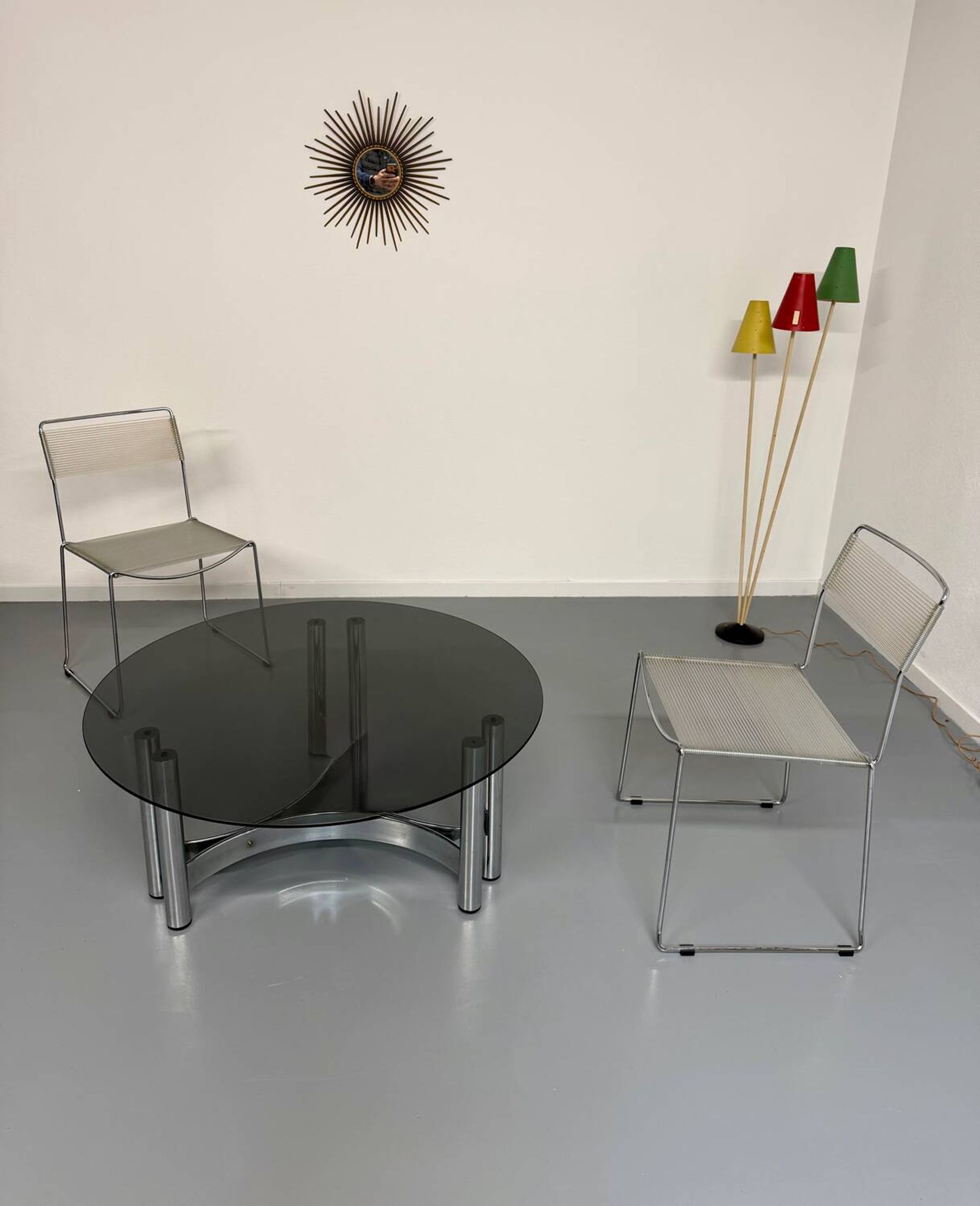 Round coffee table in smoked glass and chrome steel, 1970s design.