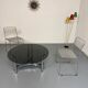 Round coffee table in smoked glass and chrome steel, 1970s design.