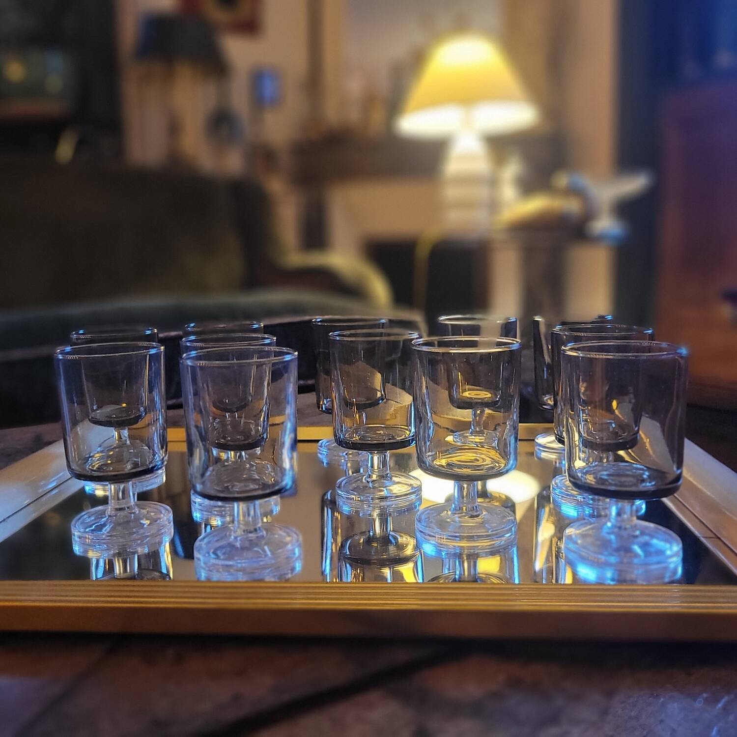 12 smoked glass stemmed glasses from the 70s and 80s.