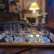 12 smoked glass stemmed glasses from the 70s and 80s.
