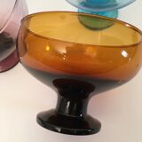 4 cups of different colors in glass
