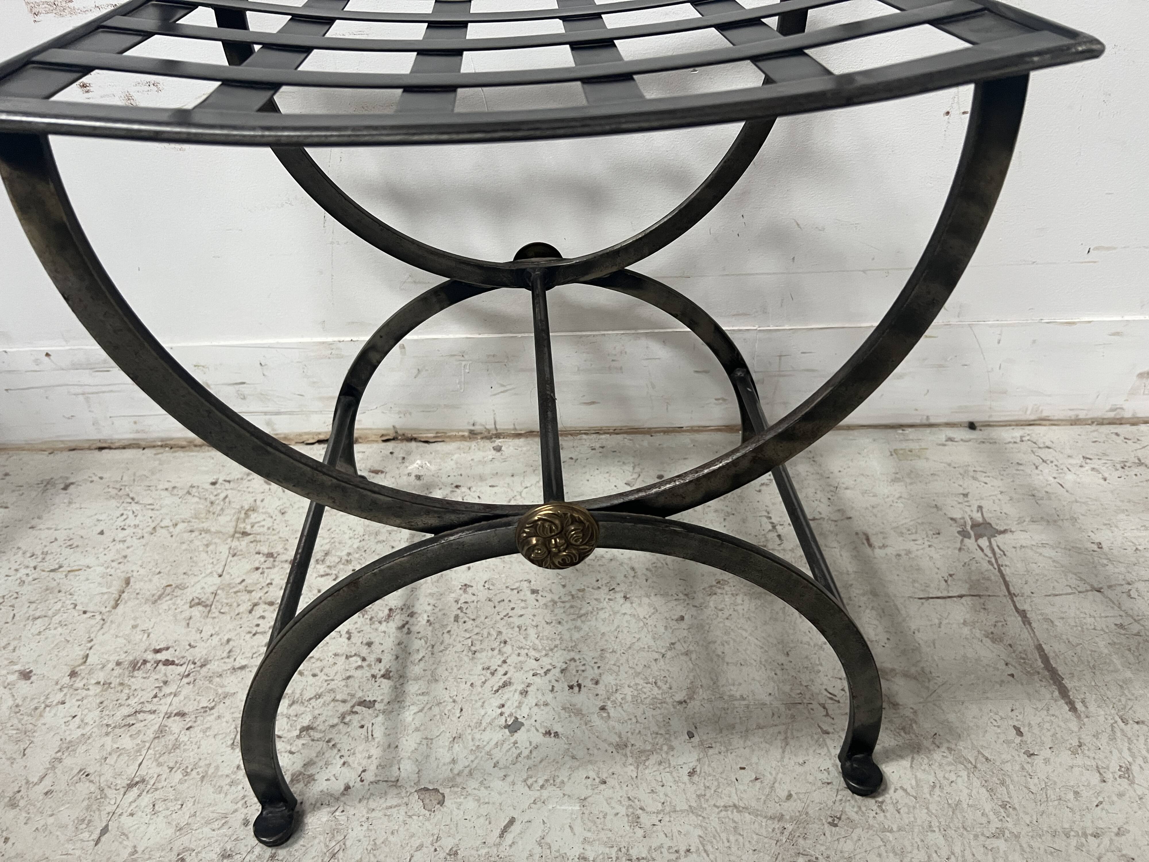 Set of four wrought iron chairs, with a reclining X-shaped base, seat and backrest.