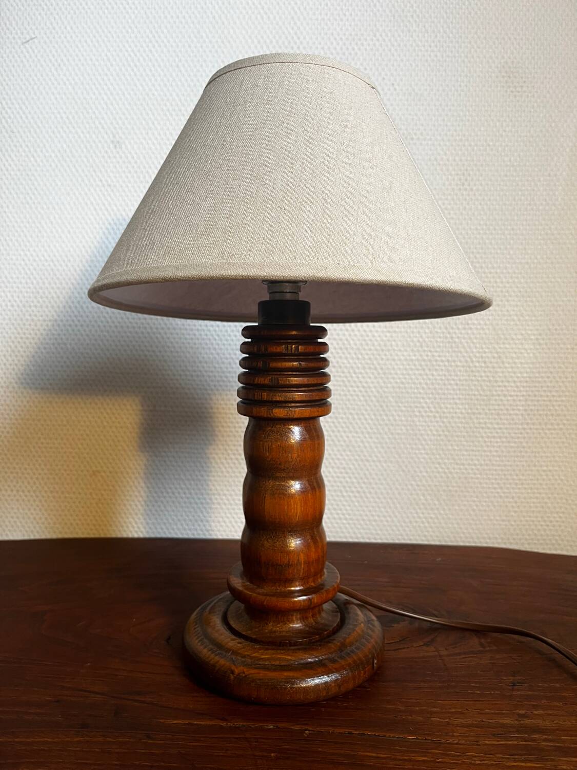 Table lamp with carved wooden base