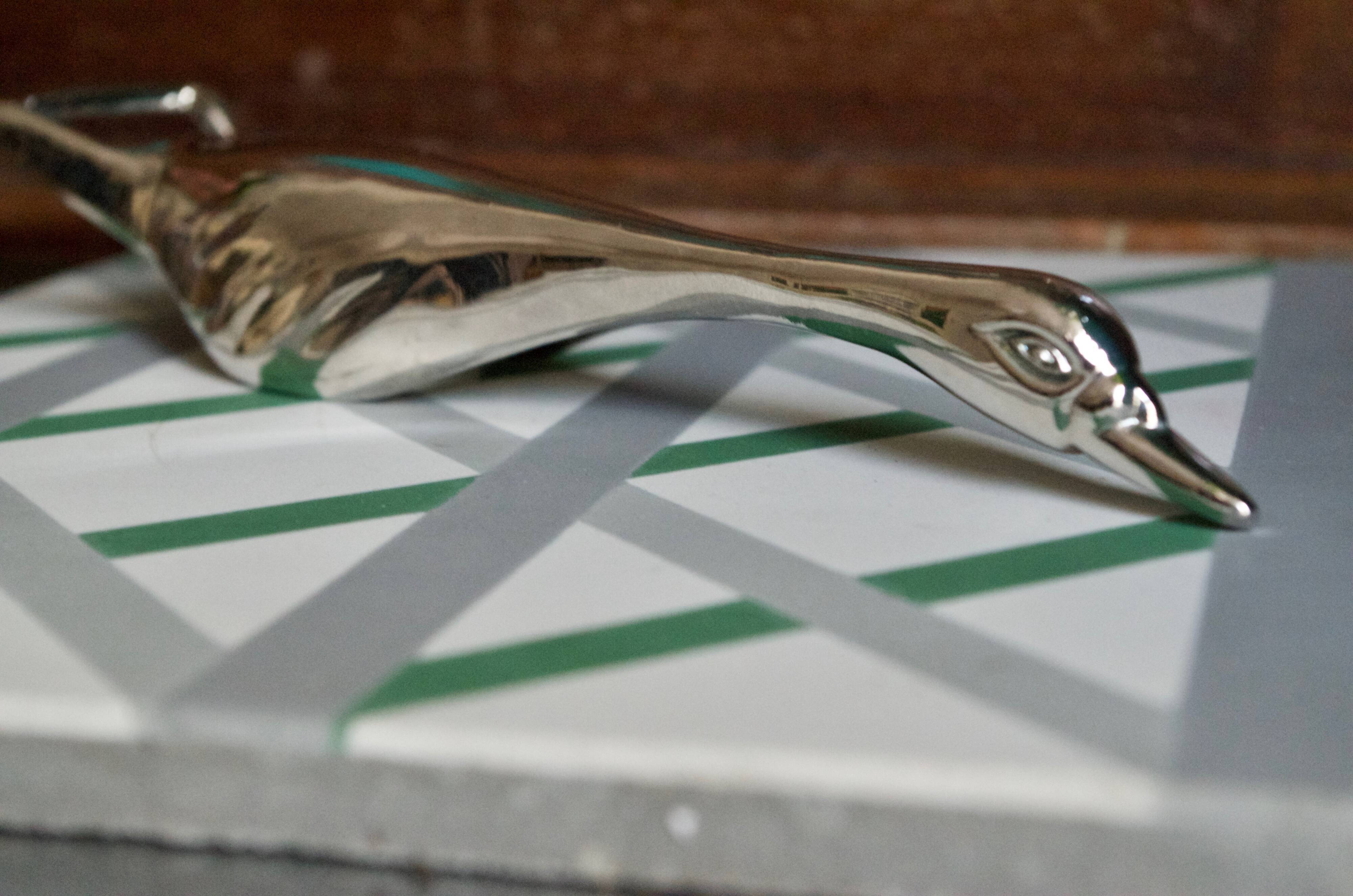 Vintage goose in flight bottle opener in silver metal