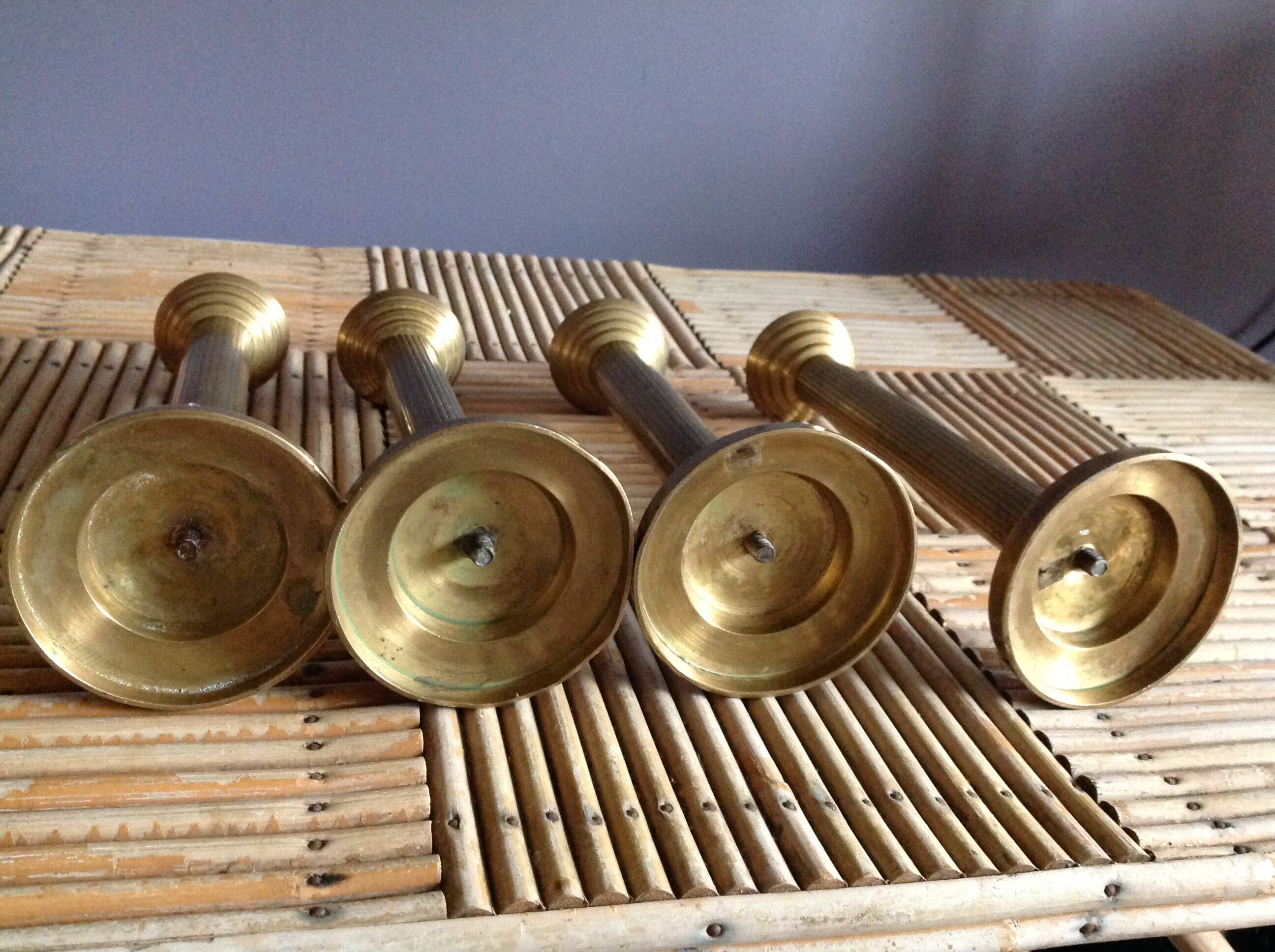 Series of 4 brass candlesticks