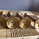 Series of 4 brass candlesticks