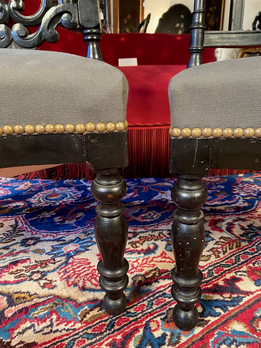 Fake pair of low Napoleon III chairs in blackened wood.
