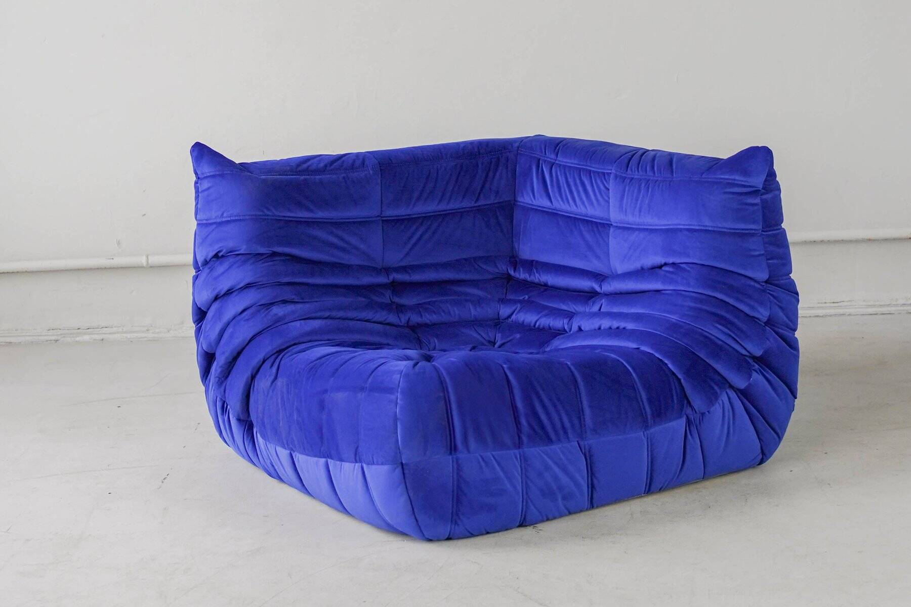 Togo corner chair in blue velvet by Michel Ducaroy for Ligne Roset