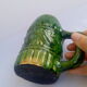 Green ceramic cup with decorations