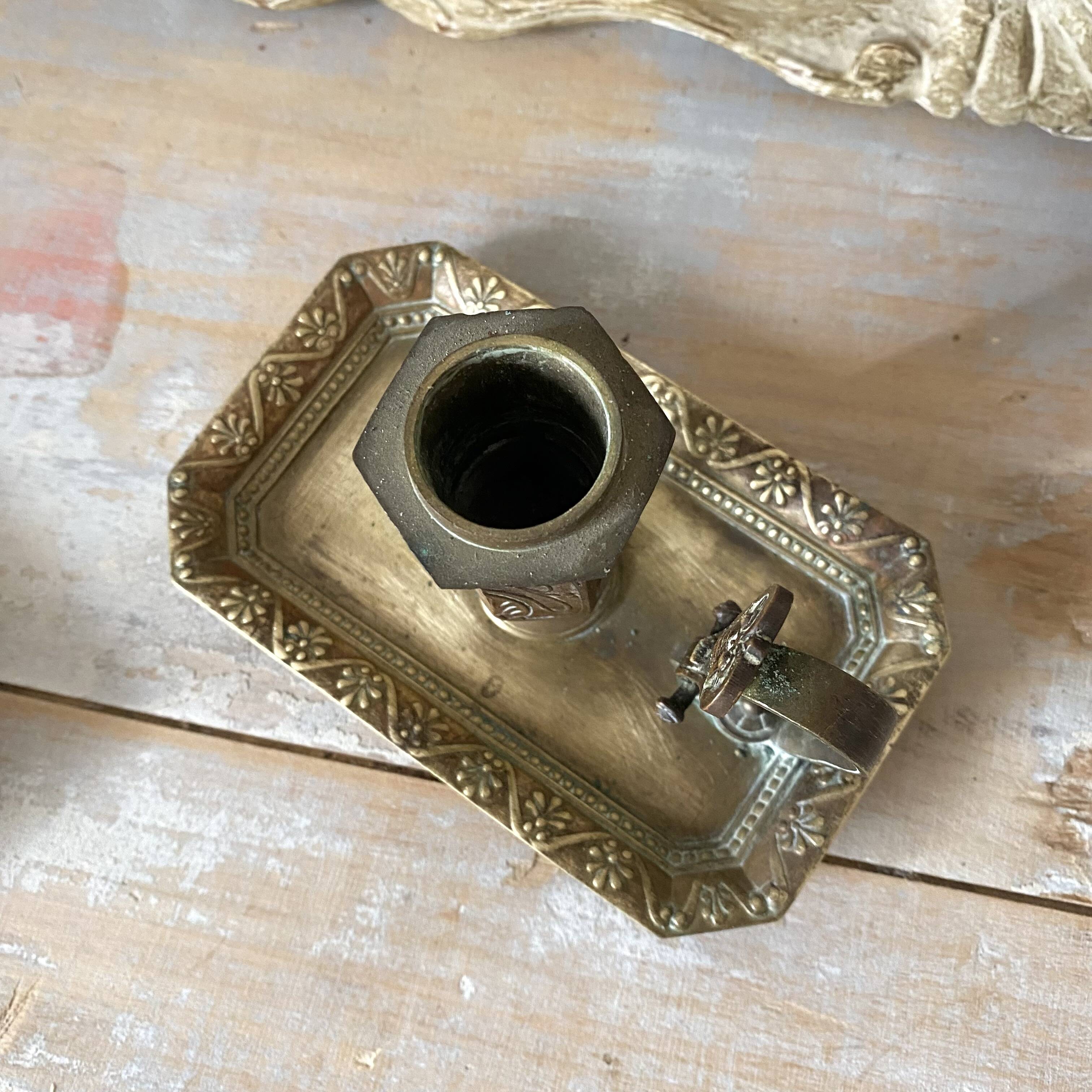 Antique brass thumb candle holder