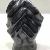 Vase with intertwined hands