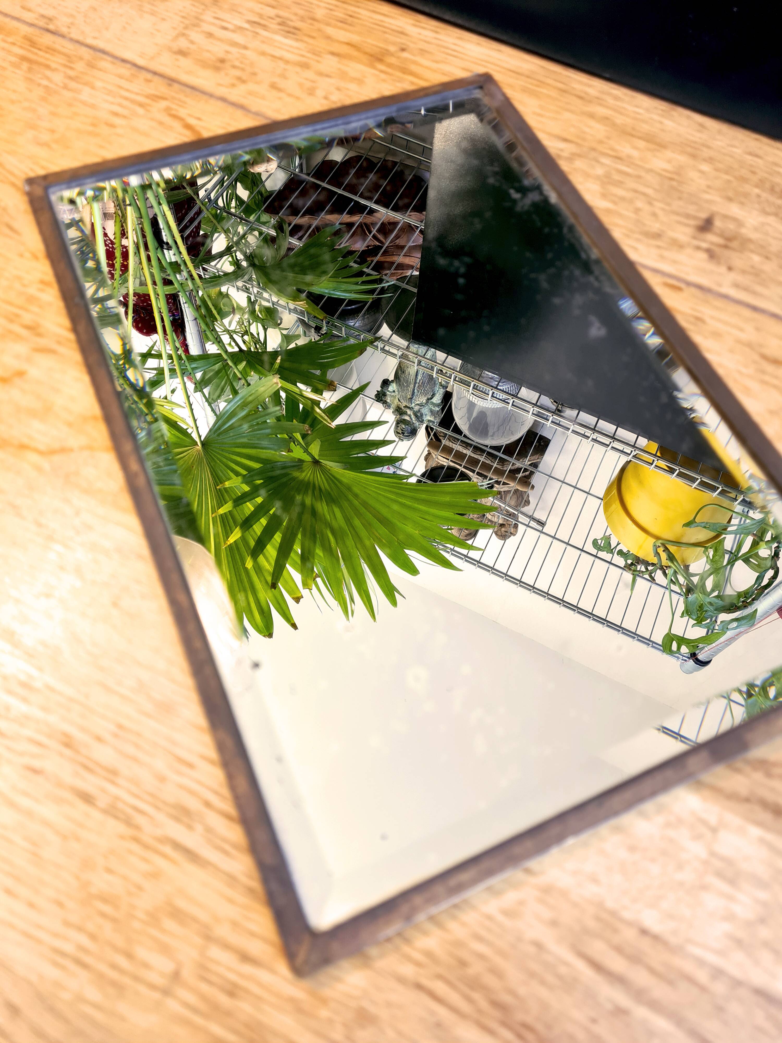 Beveled mercury mirror and japanese art nouveau illustration on the back