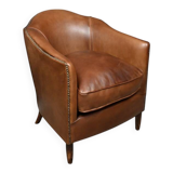 Solange club armchair in sheepskin leather.