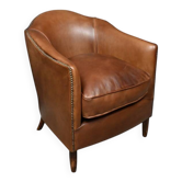 Solange club armchair in sheepskin leather.