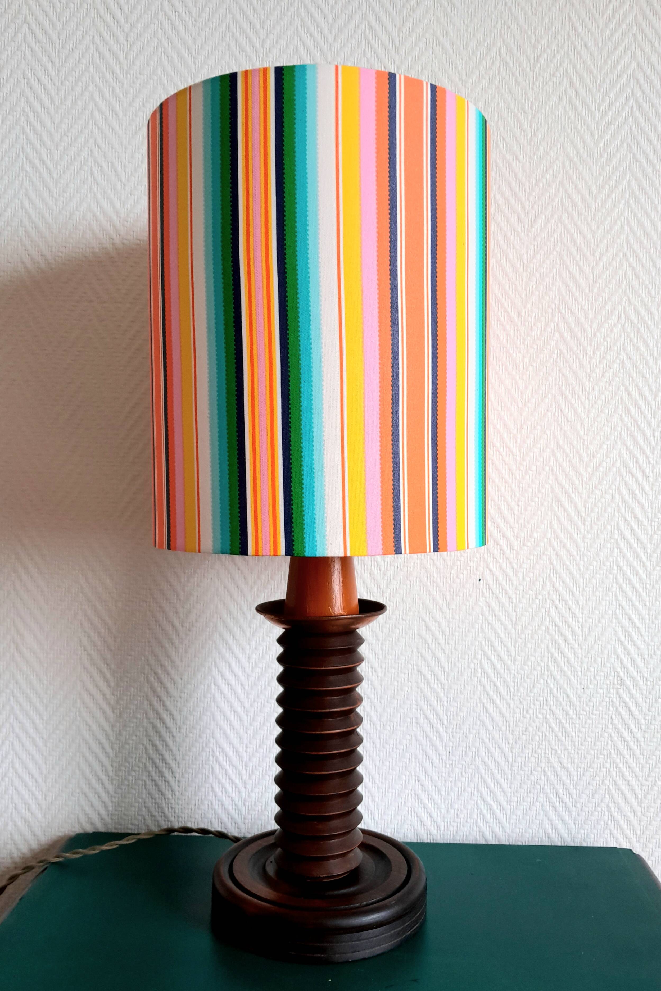 Wooden lamp with striped lampshade