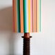 Wooden lamp with striped lampshade