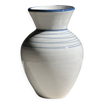 Small white and blue vase with blue circle patterns