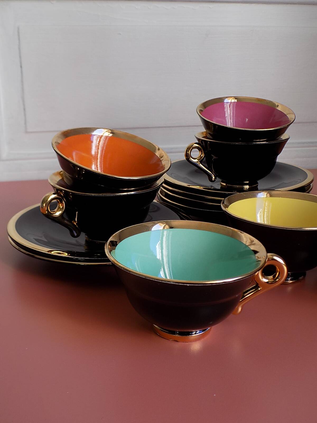 set of 9 black and gold Salins cups and saucers