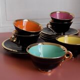 set of 9 black and gold Salins cups and saucers