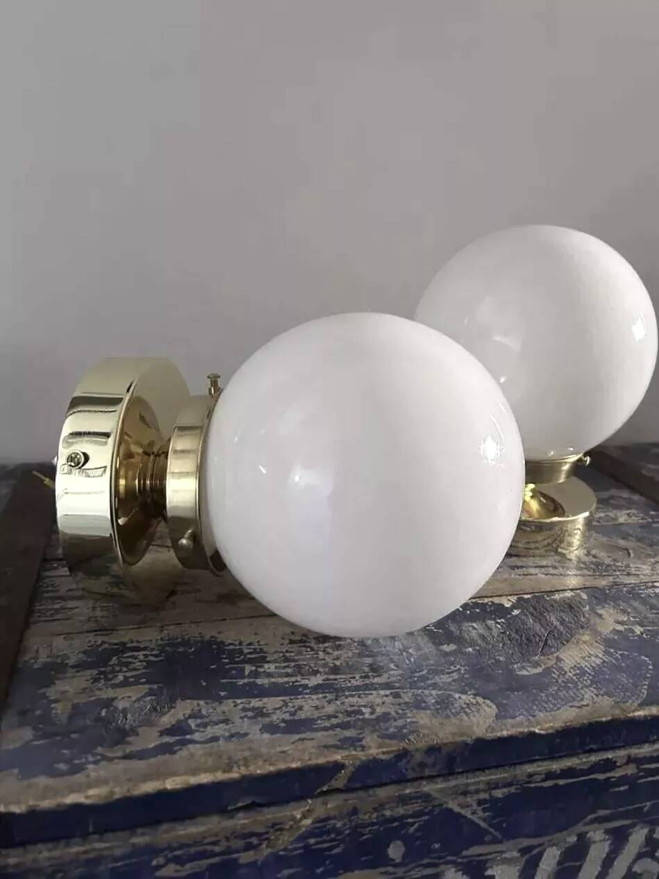 Pair of white opaline globe wall lights