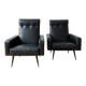Pair of vintage 70s armchairs in black faux leather.