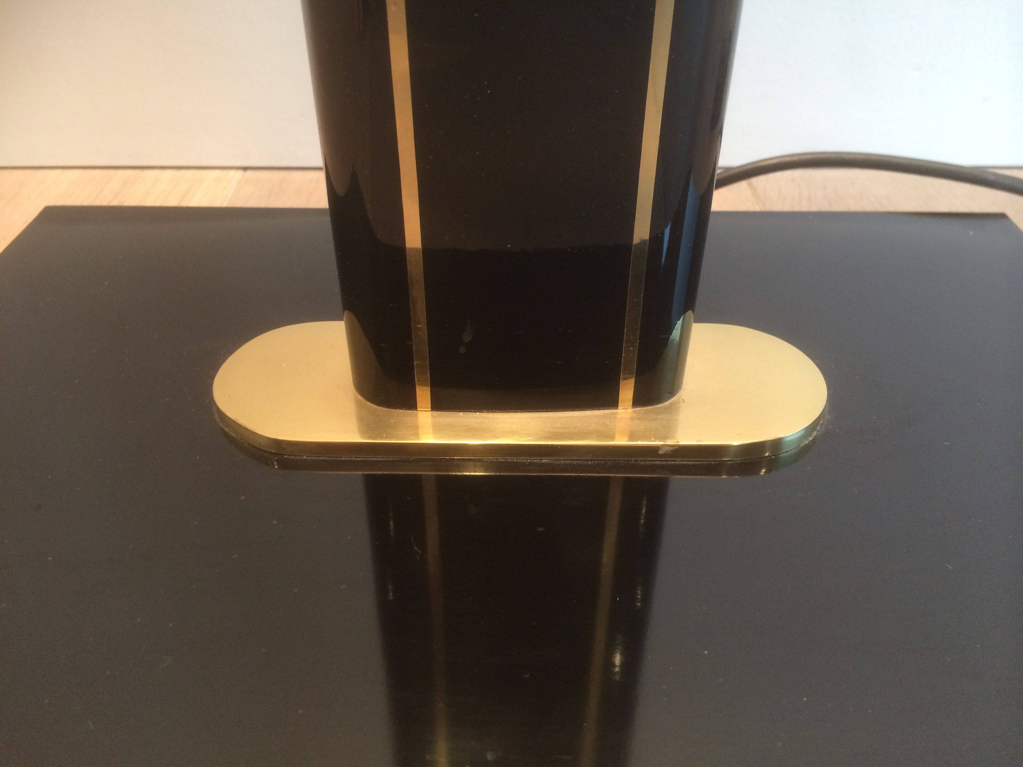 Black lacquered and brass floor lamp